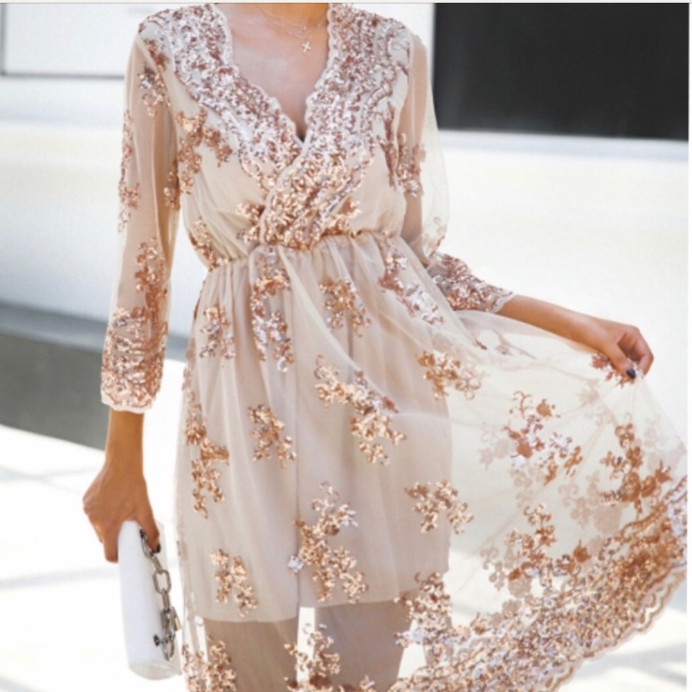 Gold sequined glamorous dress.
